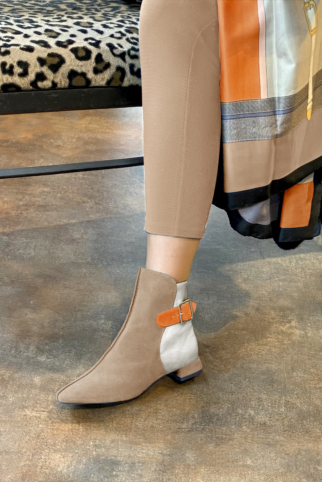 Tan beige, light silver and apricot orange women's ankle boots with buckles at the back. Square toe. Flat flare heels. Worn view - Florence KOOIJMAN